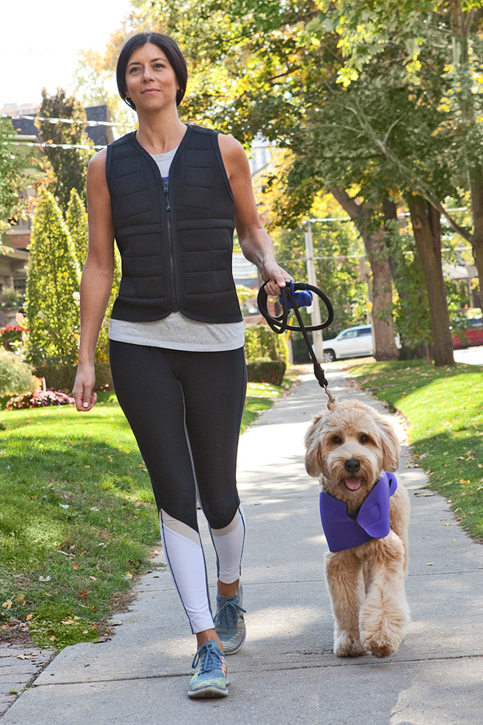 Woman walking dog in black weighted vest from Power WearHouse